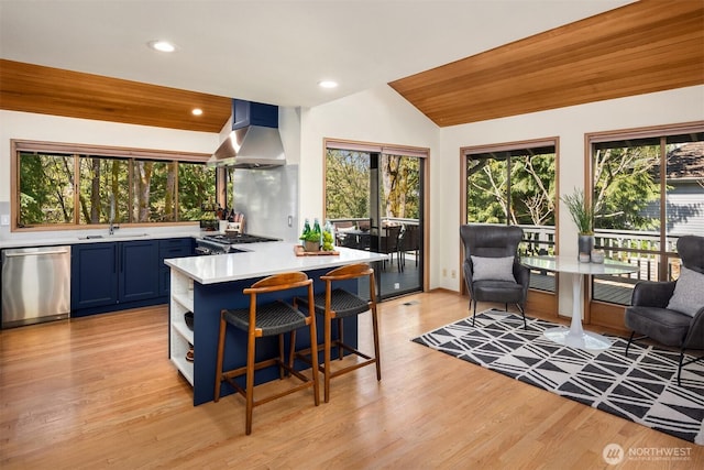 6160 W Mercer Way, Mercer Island, WA 98040 - kitchen featuring wall chimney exhaust hood, dishwasher, blue cabinets, light countertops, and a sink