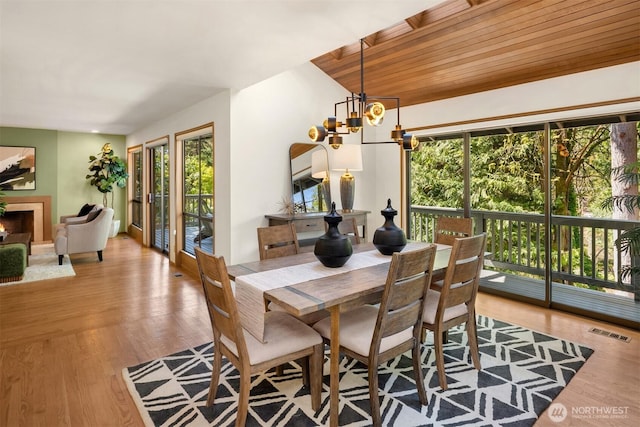 6160 W Mercer Way, Mercer Island, WA 98040 - dining area featuring a chandelier and wood finished floors