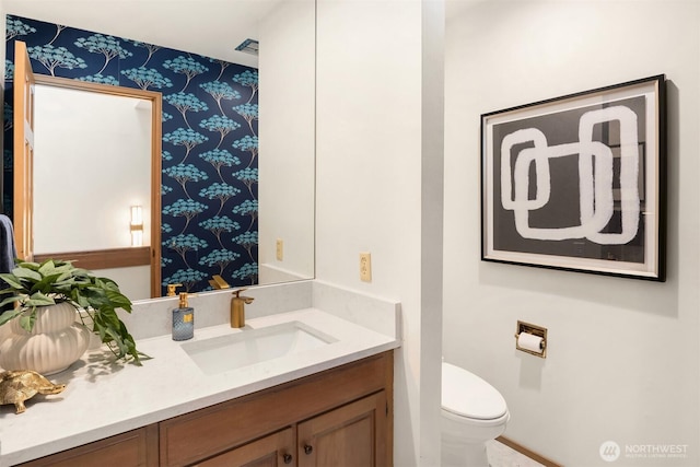 6160 W Mercer Way, Mercer Island, WA 98040 - bathroom with wallpapered walls, toilet, and vanity