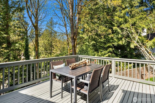 6160 W Mercer Way, Mercer Island, WA 98040 - deck with outdoor dining area and view of scattered trees