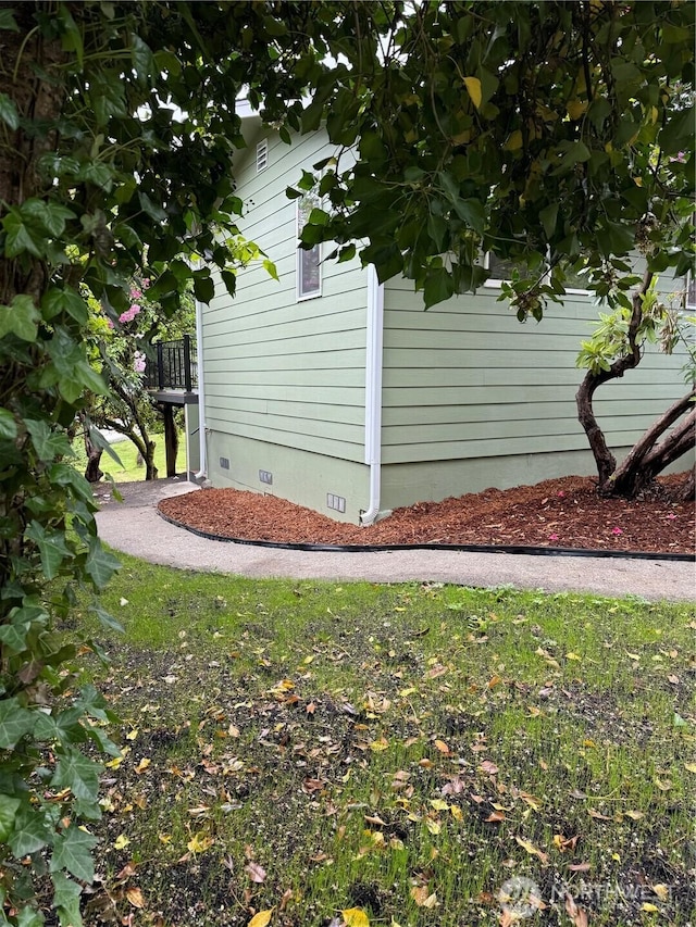 view of property exterior with crawl space