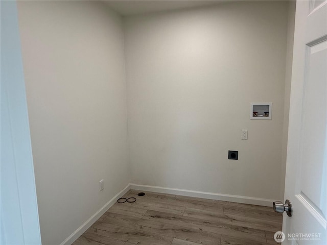 laundry area featuring washer hookup, electric dryer hookup, light wood-style floors, and baseboards