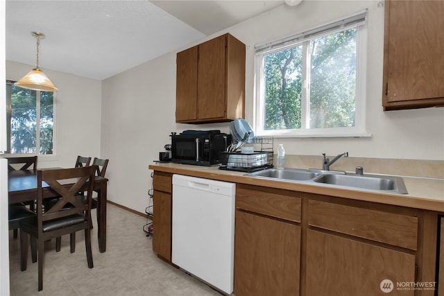 8024 N Bicentennial Loop SE, Lacey, WA 98503 - kitchen with dishwasher, black microwave, a sink, light countertops, and pendant lighting