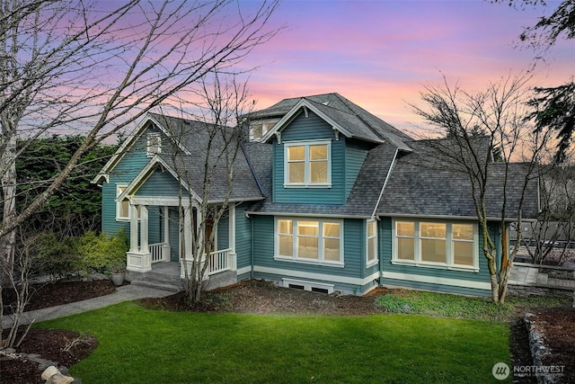 23623 20th Ave W, Bothell, WA 98021 - back of house at dusk featuring covered porch, a lawn, and roof with shingles