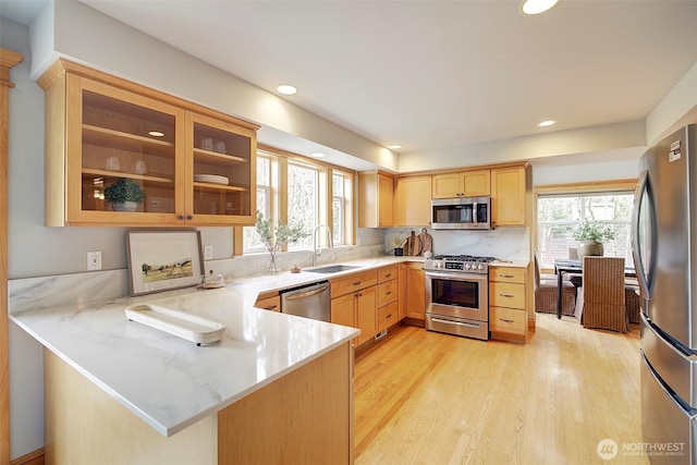 23623 20th Ave W, Bothell, WA 98021 - kitchen featuring stainless steel appliances, healthy amount of natural light, a peninsula, a sink, and recessed lighting
