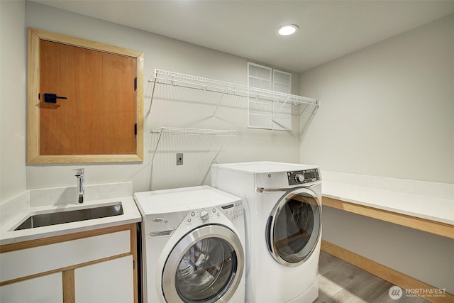 23623 20th Ave W, Bothell, WA 98021 - laundry area with washing machine and dryer, cabinet space, light wood-style floors, and recessed lighting