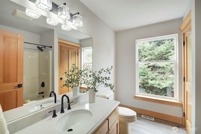 23623 20th Ave W, Bothell, WA 98021 - full bathroom with toilet, vanity, healthy amount of natural light, and bathtub / shower combination
