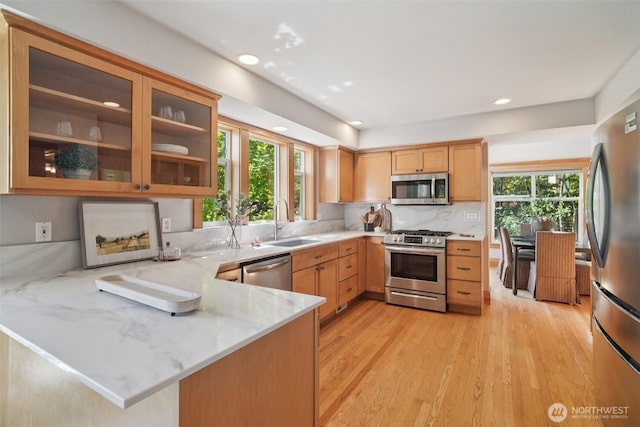 23623 20th Ave W, Bothell, WA 98021 - kitchen with stainless steel appliances, a peninsula, plenty of natural light, backsplash, and recessed lighting