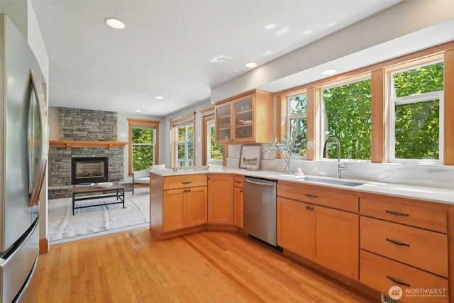 23623 20th Ave W, Bothell, WA 98021 - kitchen with stainless steel appliances, open floor plan, light wood-type flooring, a peninsula, and light countertops