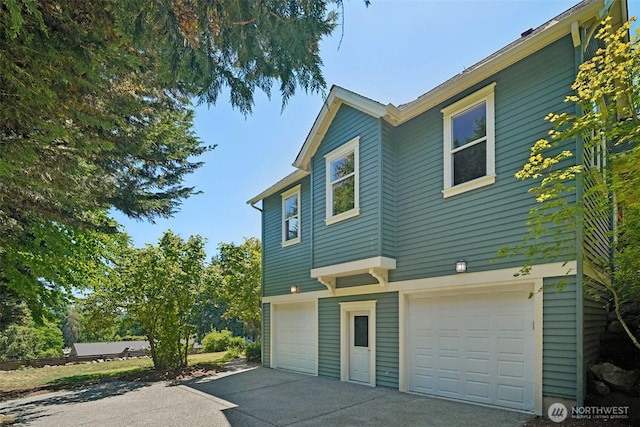 23623 20th Ave W, Bothell, WA 98021 - view of property exterior with an attached garage and driveway