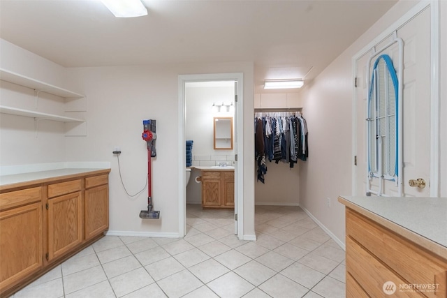 4 Alder Ct, Bellingham, WA 98229 - bathroom with vanity, tile patterned floors, baseboards, and a walk in closet