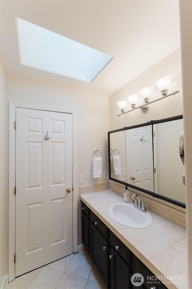 4 Alder Ct, Bellingham, WA 98229 - bathroom featuring a skylight, vanity, and tile patterned floors