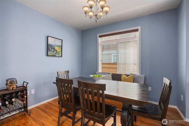 176 Raspberry Ln, Woodland, WA 98674 - dining room with a chandelier, wood finished floors, and baseboards