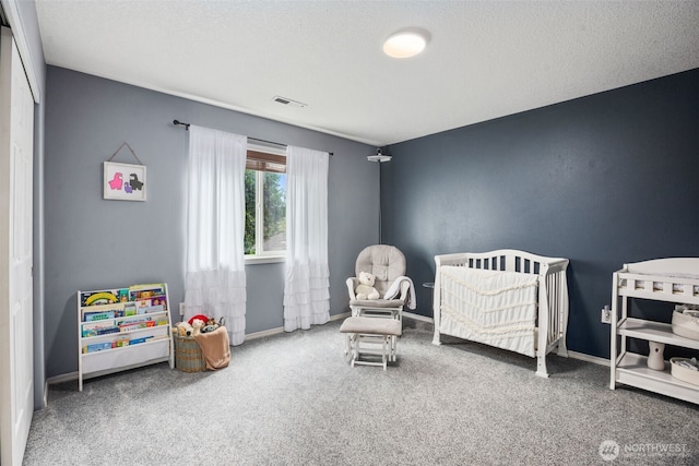 176 Raspberry Ln, Woodland, WA 98674 - carpeted bedroom with a nursery area and baseboards