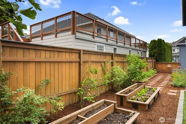 176 Raspberry Ln, Woodland, WA 98674 - fenced backyard featuring a vegetable garden