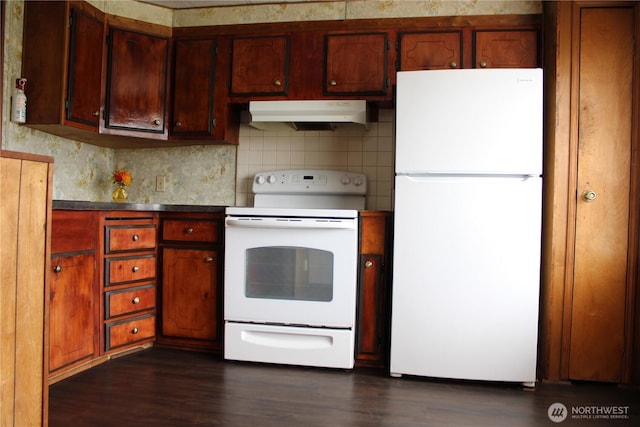 kitchen with white appliances, under cabinet range hood, dark wood-style flooring, and tasteful backsplash