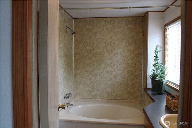 bathroom featuring healthy amount of natural light, a bathtub, vanity, and a shower