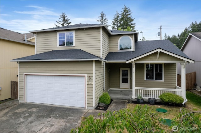 2538 Hidden Springs Loop SE, Olympia, WA 98503 - traditional-style home with a garage, a porch, driveway, and roof with shingles