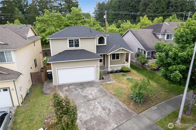 2538 Hidden Springs Loop SE, Olympia, WA 98503 - traditional home featuring a shingled roof, concrete driveway, a garage, and covered porch