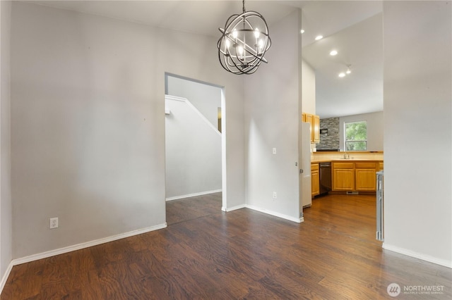 2538 Hidden Springs Loop SE, Olympia, WA 98503 - unfurnished dining area with dark wood-style floors, a chandelier, a sink, lofted ceiling, and baseboards
