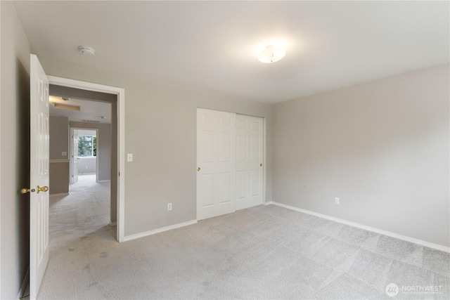 2538 Hidden Springs Loop SE, Olympia, WA 98503 - unfurnished bedroom with light carpet, baseboards, and a closet