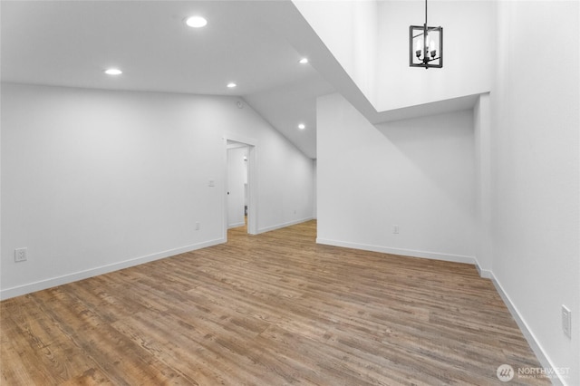 7409 Myers Rd, Bonney Lake, WA 98391 - unfurnished living room with recessed lighting, light wood-type flooring, a chandelier, and lofted ceiling
