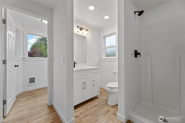 7409 Myers Rd, Bonney Lake, WA 98391 - full bath featuring wood finished floors, vanity, a shower, and recessed lighting