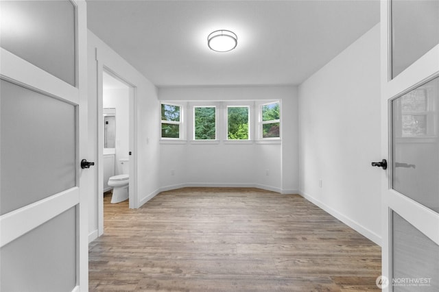 7409 Myers Rd, Bonney Lake, WA 98391 - unfurnished bedroom featuring wood finished floors and ensuite bath