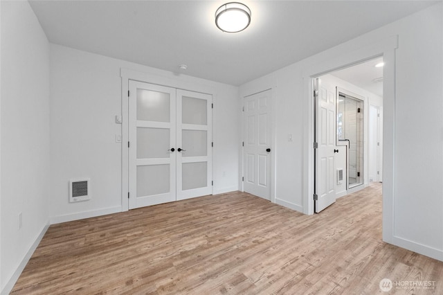 7409 Myers Rd, Bonney Lake, WA 98391 - unfurnished bedroom with light wood-style floors and baseboards
