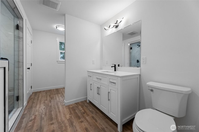 7409 Myers Rd, Bonney Lake, WA 98391 - full bath featuring vanity, wood finished floors, and a shower stall