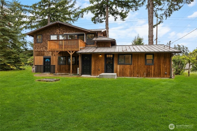 7409 Myers Rd, Bonney Lake, WA 98391 - rustic home with a front yard, a metal roof, a balcony, and a standing seam roof
