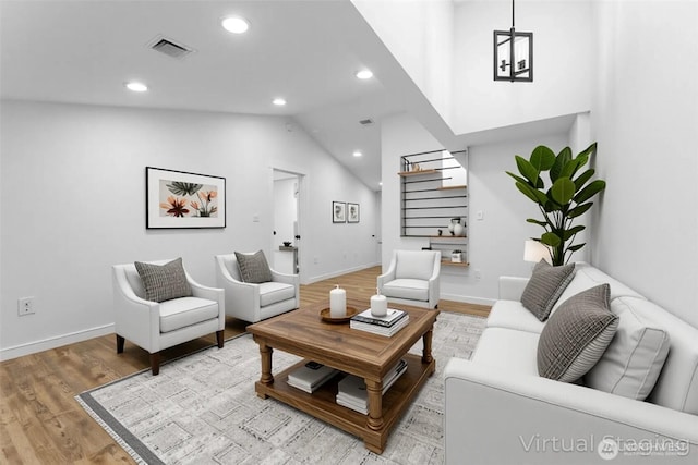 7409 Myers Rd, Bonney Lake, WA 98391 - living room with recessed lighting, light wood-style floors, stairway, and lofted ceiling