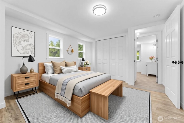 7409 Myers Rd, Bonney Lake, WA 98391 - bedroom featuring light wood-type flooring and a closet