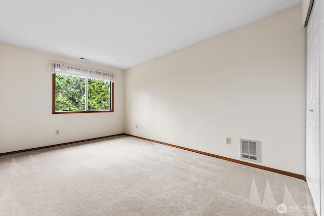 3238 NE 100th St Unit D, Seattle, WA 98125 - carpeted empty room featuring baseboards