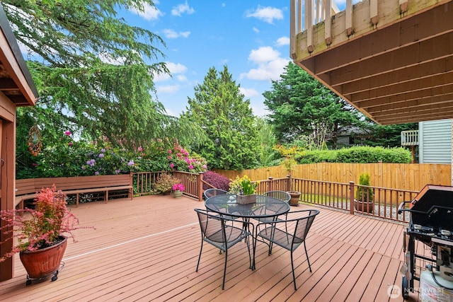 3238 NE 100th St Unit D, Seattle, WA 98125 - wooden deck with outdoor dining area and area for grilling