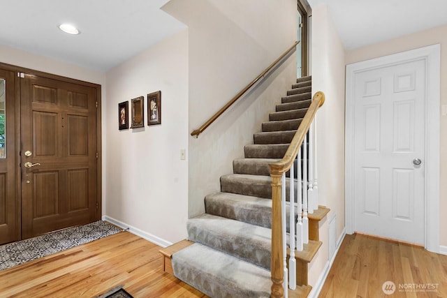 3238 NE 100th St Unit D, Seattle, WA 98125 - foyer with baseboards, light wood finished floors, stairs, and recessed lighting