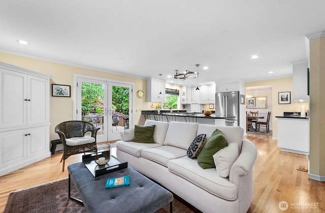 3238 NE 100th St Unit D, Seattle, WA 98125 - living room with crown molding, light wood finished floors, and recessed lighting