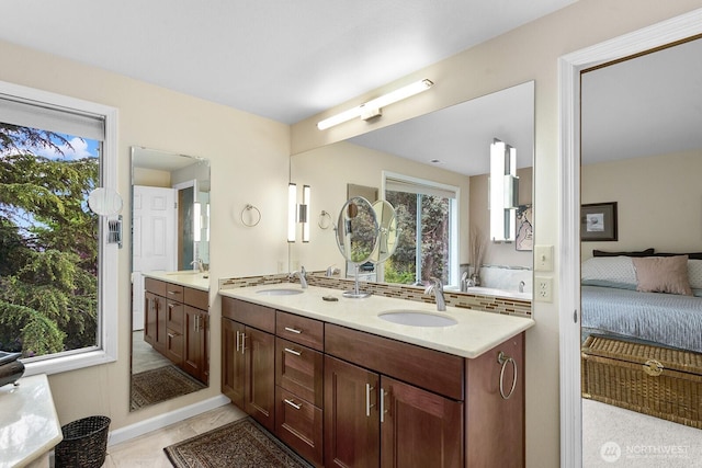 3238 NE 100th St Unit D, Seattle, WA 98125 - bathroom with double vanity, connected bathroom, and plenty of natural light