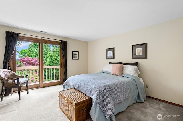 3238 NE 100th St Unit D, Seattle, WA 98125 - bedroom with light colored carpet, access to outside, and baseboards