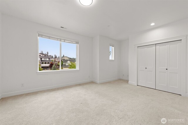 10815 NE 190th Pl, Bothell, WA 98011 - unfurnished bedroom with carpet floors, baseboards, recessed lighting, and a closet