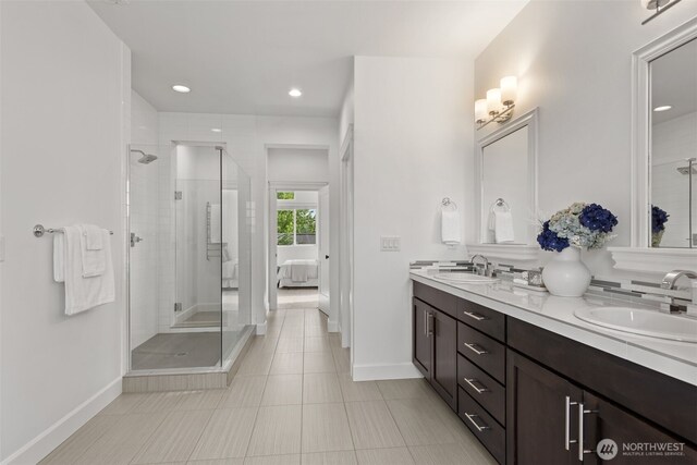 10815 NE 190th Pl, Bothell, WA 98011 - bathroom with double vanity, a stall shower, tile patterned flooring, baseboards, and recessed lighting