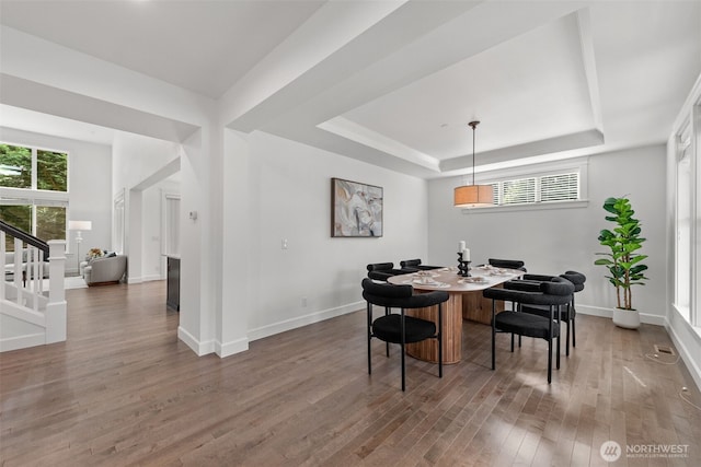10815 NE 190th Pl, Bothell, WA 98011 - dining space with wood finished floors, a tray ceiling, baseboards, and stairway