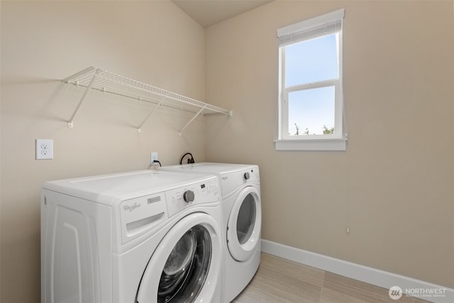 10815 NE 190th Pl, Bothell, WA 98011 - laundry area with washing machine and clothes dryer and baseboards
