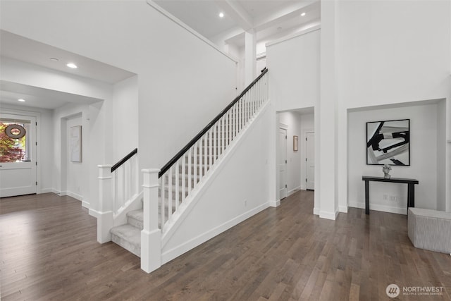 10815 NE 190th Pl, Bothell, WA 98011 - stairway featuring wood finished floors, recessed lighting, baseboards, and a high ceiling