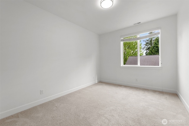 10815 NE 190th Pl, Bothell, WA 98011 - spare room with baseboards and light carpet