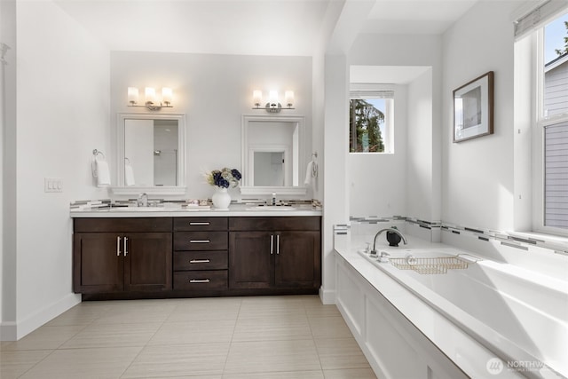 10815 NE 190th Pl, Bothell, WA 98011 - bathroom with double vanity, a garden tub, tile patterned floors, and baseboards