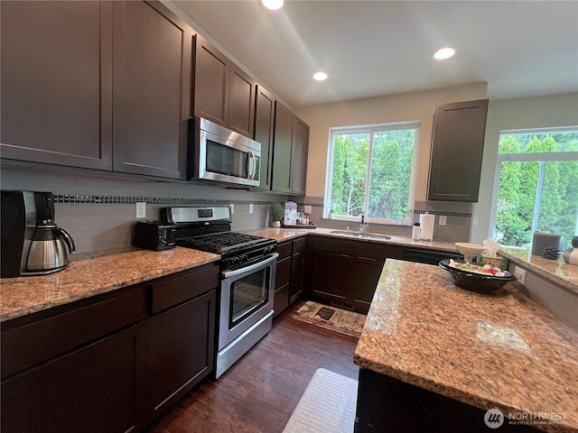 2805 93rd Pl SE, Everett, WA 98208 - kitchen with stainless steel appliances, a sink, recessed lighting, backsplash, and light stone countertops