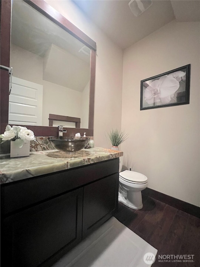 2805 93rd Pl SE, Everett, WA 98208 - bathroom featuring wood finished floors, toilet, vanity, and baseboards
