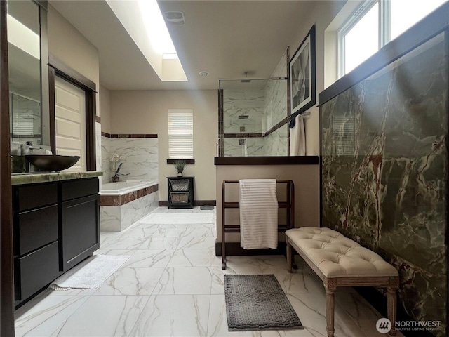2805 93rd Pl SE, Everett, WA 98208 - full bath featuring marble look tiles, a garden tub, walk in shower, and vanity