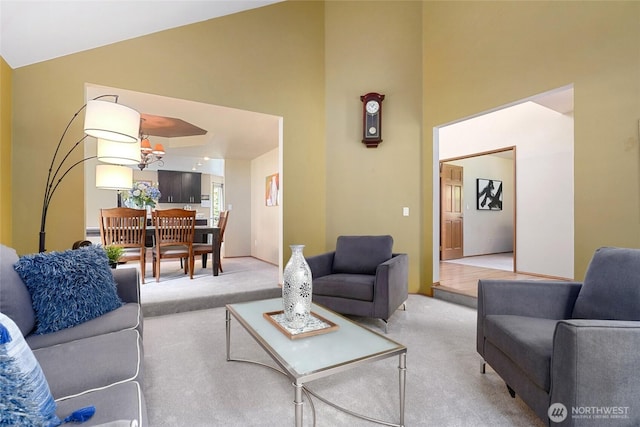 13218 42nd Ave W, Mukilteo, WA 98275 - carpeted living room with high vaulted ceiling and a chandelier